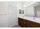 Bathroom with double vanity and dark brown cabinets at 3632 Shimmering Oaks Dr, Parrish, FL 34219