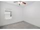 Bright bedroom with ceiling fan and grey carpet at 3632 Shimmering Oaks Dr, Parrish, FL 34219