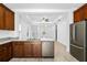 Open-concept kitchen with island, stainless steel appliances, and view of living room at 3632 Shimmering Oaks Dr, Parrish, FL 34219