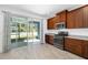 Modern kitchen with stainless steel appliances and granite countertops at 3632 Shimmering Oaks Dr, Parrish, FL 34219