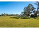 Open green space with trees, soccer goals, and benches at 3632 Shimmering Oaks Dr, Parrish, FL 34219