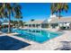 Community pool with a clubhouse and plenty of lounge chairs at 3632 Shimmering Oaks Dr, Parrish, FL 34219