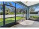 Spacious screened porch overlooking a fenced backyard at 3632 Shimmering Oaks Dr, Parrish, FL 34219