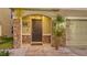 Dark brown front door with stone accents and a welcome home sign at 3809 Golden Oriole Pkwy, Sarasota, FL 34232