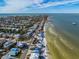 Aerial view of beachfront home showcasing its location and ocean views at 404 S Bay Blvd, Anna Maria, FL 34216