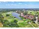 Aerial view of upscale community with golf course and lake at 4501 Murcia Blvd # 7, Sarasota, FL 34238