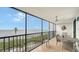 Spacious screened balcony with ocean views and seating area at 4545 Gulf Of Mexico Dr # 408, Longboat Key, FL 34228