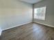 Well-lit bedroom with large window and wood-look floors at 4802 51St W St # 1806, Bradenton, FL 34210