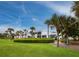 Modern condo building with lush landscaping at 520 Bayport Way, Longboat Key, FL 34228