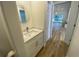 Modern powder room with white vanity and quartz countertop at 5373 Dominica Cir, Sarasota, FL 34233