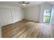 Bedroom featuring light wood floors and built-in closet at 5373 Dominica Cir, Sarasota, FL 34233