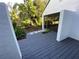 Gray deck and walkway leading to a screened porch at 5373 Dominica Cir, Sarasota, FL 34233