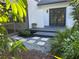 Backyard deck with stone pathway and landscaping at 5373 Dominica Cir, Sarasota, FL 34233