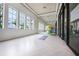 Bright yoga studio with herringbone floors and natural light at 5697 Long Shore Loop, Sarasota, FL 34238