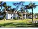 Condo building with water view and lush landscaping at 626 Bird Bay S Dr # 204, Venice, FL 34285