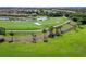 Aerial view of community with golf course and homes at 6517 Willowshire Way, Bradenton, FL 34212
