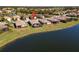 Aerial view of home and lake in a beautiful residential neighborhood at 6517 Willowshire Way, Bradenton, FL 34212