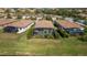 Aerial view of homes with screened pools and lush landscaping at 6517 Willowshire Way, Bradenton, FL 34212