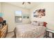 Bedroom with a queen-size bed and tropical-themed art at 6517 Willowshire Way, Bradenton, FL 34212