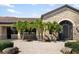Gated entrance to the community with stonework and lush landscaping at 6517 Willowshire Way, Bradenton, FL 34212