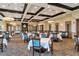Spacious dining room with multiple tables and chairs at 6517 Willowshire Way, Bradenton, FL 34212