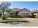 Single story home with attached garage and manicured landscaping at 6517 Willowshire Way, Bradenton, FL 34212