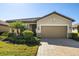 Single-story home with attached garage, landscaping, and brick driveway at 6517 Willowshire Way, Bradenton, FL 34212