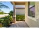 Welcoming front porch with brick flooring and lush landscaping at 6517 Willowshire Way, Bradenton, FL 34212