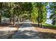 Paved path alongside a lake, surrounded by trees at 6517 Willowshire Way, Bradenton, FL 34212