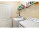 Laundry room with washer, dryer, and overhead shelving at 6517 Willowshire Way, Bradenton, FL 34212