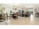 Spacious living room with tile floors and sliding glass doors at 6517 Willowshire Way, Bradenton, FL 34212