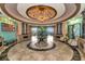 Elegant community lobby with high ceilings and comfortable seating at 6517 Willowshire Way, Bradenton, FL 34212
