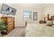 Main bedroom with large TV and dresser at 6517 Willowshire Way, Bradenton, FL 34212