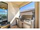 Modern outdoor kitchen with stainless steel appliances and built-in grill at 6517 Willowshire Way, Bradenton, FL 34212