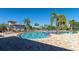 Large community pool area with plenty of lounge chairs at 6517 Willowshire Way, Bradenton, FL 34212