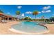 Community pool with lounge chairs and a area at 6517 Willowshire Way, Bradenton, FL 34212