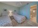 Guest bedroom with twin beds and adjacent bathroom access at 6800 Placida Rd # 2016, Englewood, FL 34224