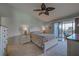 Bright main bedroom with a comfortable bed and access to a balcony at 6800 Placida Rd # 2016, Englewood, FL 34224