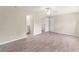 Spacious bedroom with wood-look floors and ceiling fan at 6993 Hawksbury St, Englewood, FL 34224