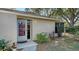 Front entrance with a burgundy door and landscaped walkway at 754 N Jefferson Ave # 754, Sarasota, FL 34237