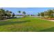 Expansive community lawn with scenic lake views at 764 Tailwind Pl, Sarasota, FL 34240