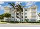 Three-story condo building with palm trees and balconies at 7840 34Th W Ave # 103, Bradenton, FL 34209