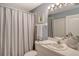 Simple bathroom with shower/tub combo and crisp white vanity at 8755 Olde Hickory Ave # 7101, Sarasota, FL 34238