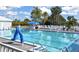 Large community pool with surrounding lounge chairs at 905 Addington Ct # 102, Venice, FL 34293