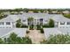 Complex of two-story buildings with lush landscaping at 905 Addington Ct # 203, Venice, FL 34293