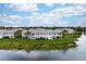 Aerial view of lakefront condo, showcasing patio at 905 Addington Ct # 203, Venice, FL 34293