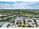Aerial view of a community with lakefront properties at 905 Addington Ct # 203, Venice, FL 34293