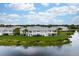 Aerial view of lakefront condo, showcasing patio at 905 Addington Ct # 203, Venice, FL 34293