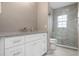 Bathroom with a stone countertop, a glass enclosed shower and modern fixtures at 905 Addington Ct # 203, Venice, FL 34293