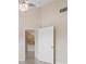 Primary bedroom with high ceilings and a doorway to the ensuite bathroom at 905 Addington Ct # 203, Venice, FL 34293